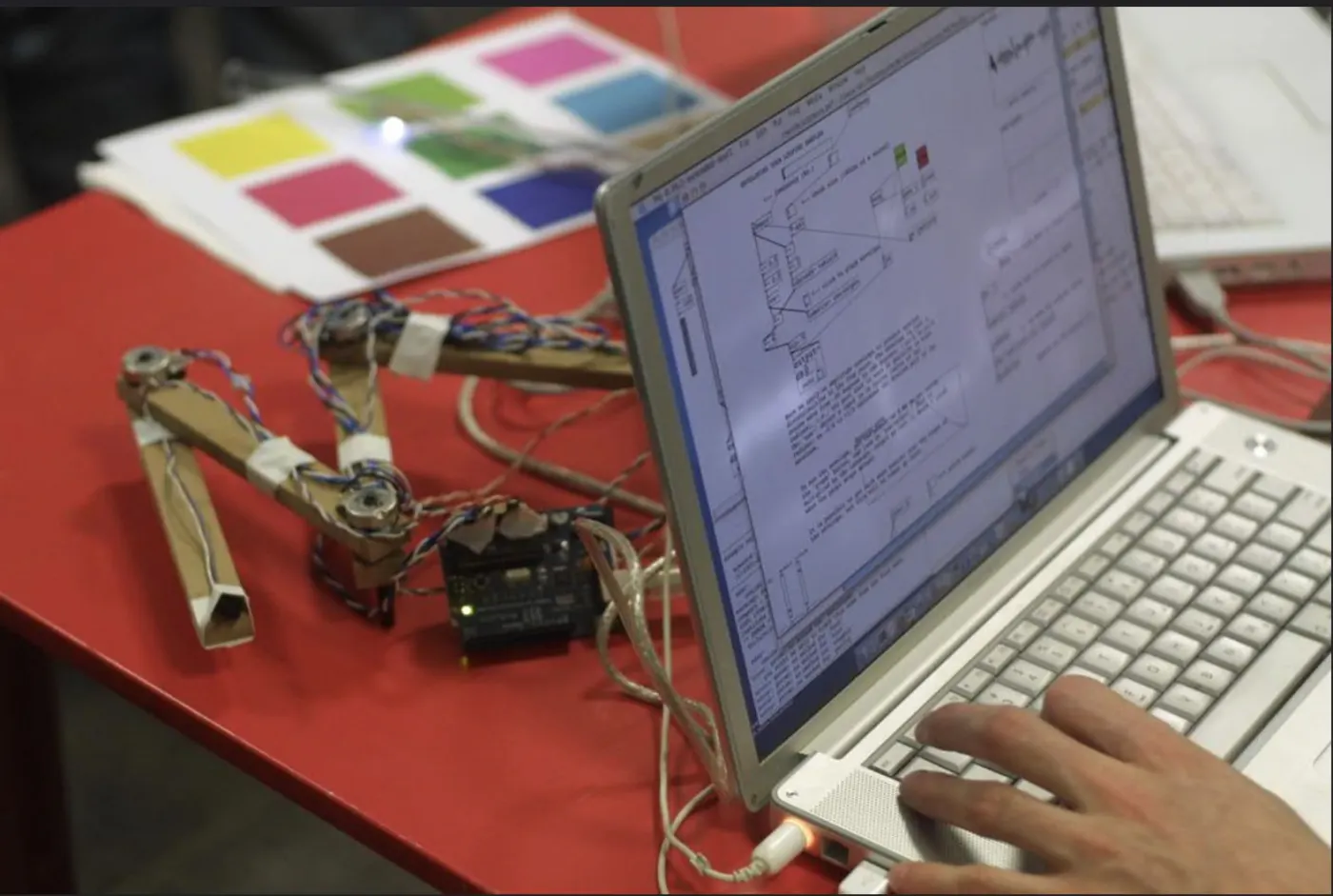 An electronics rig connected to a laptop on a desk